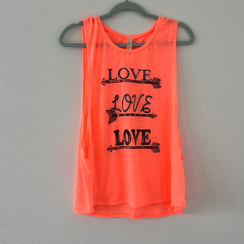 Bright salmon color top with wide arm openings